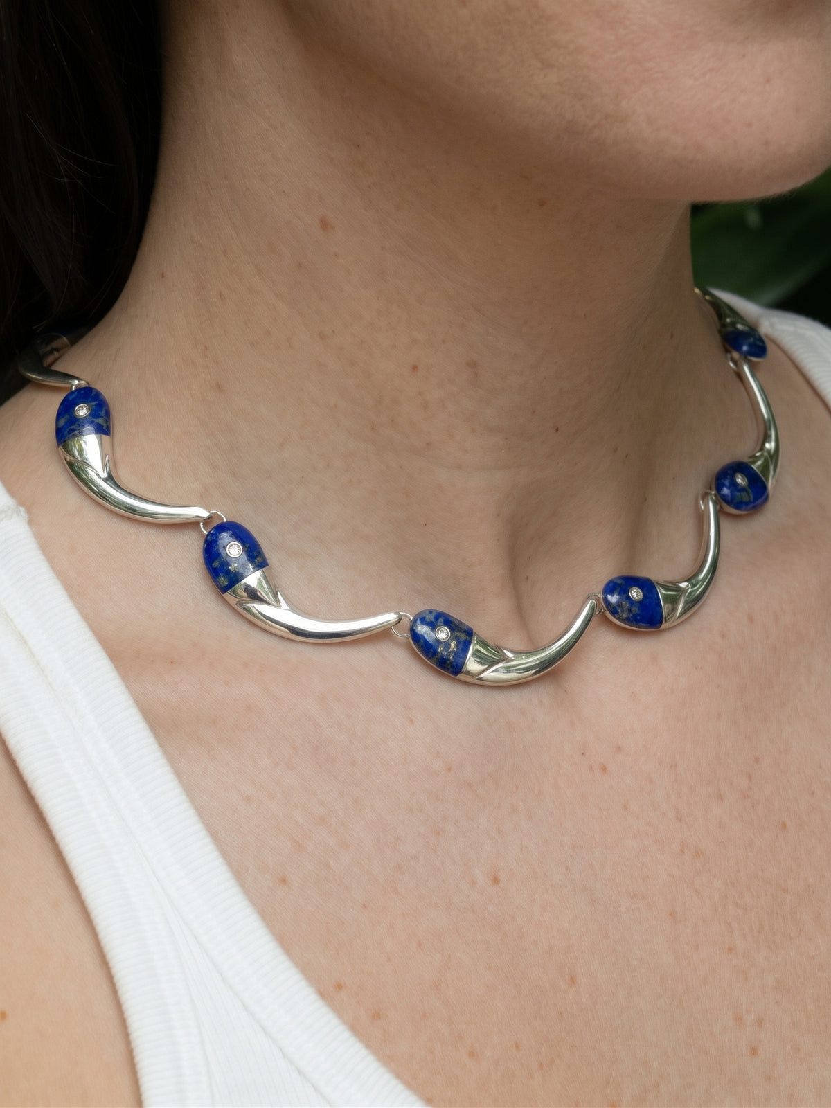 Pez Necklace in sterling silver with lapis lazuli, worn on the model — handmade in Taxco, Mexico #Gemstone Type_Lapis lazuli