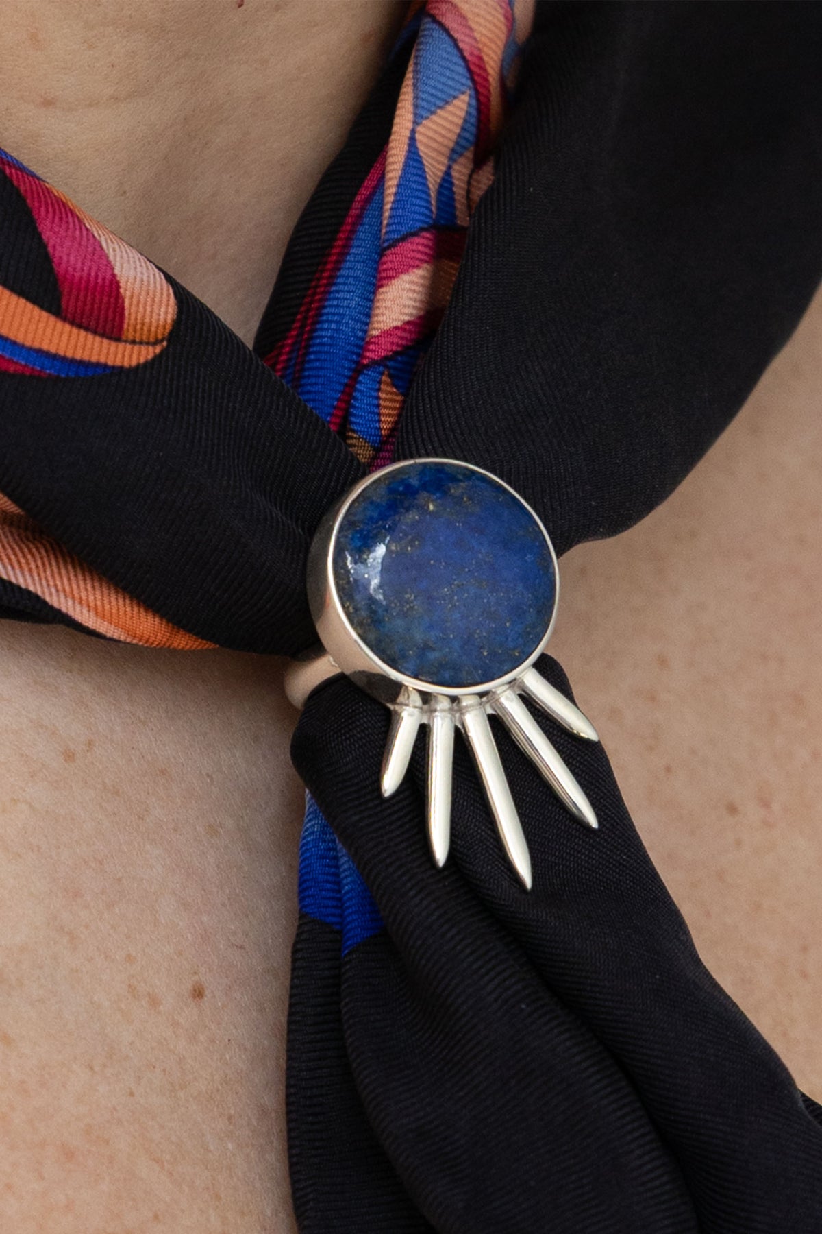 Sol Scarf Ring in sterling silver with lapis lazuli, on model — handmade in Taxco, Mexico #Gemstone Type_Lapis lazuli