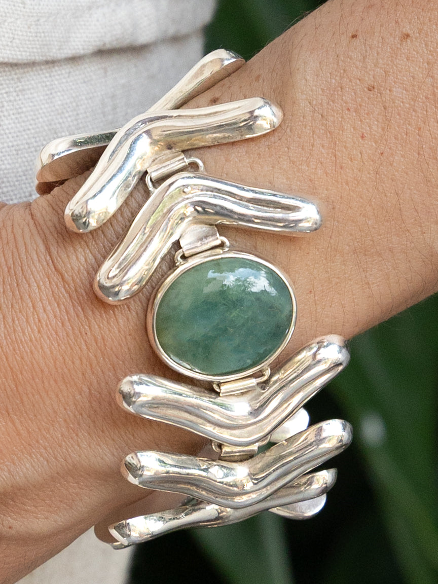 Lengua Center Stone Bracelet in sterling silver with jade, on model — handmade in Taxco, Mexico #Gemstone Type_Jade