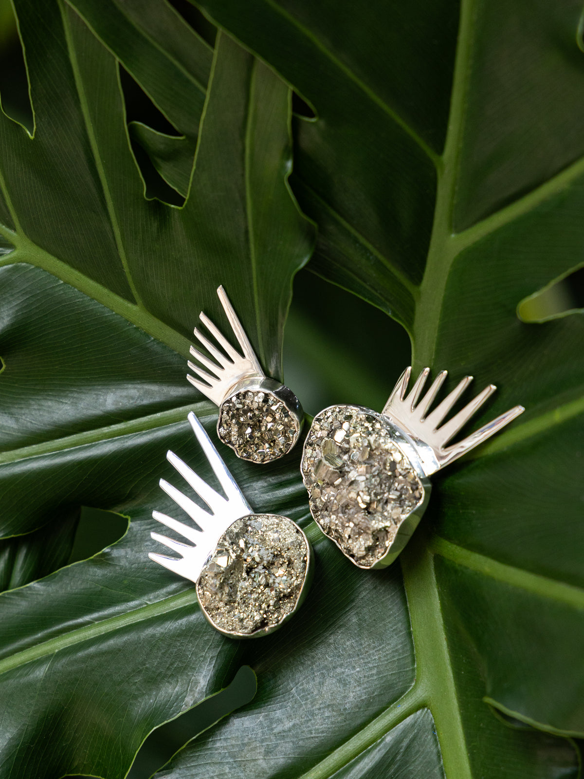 Sol pins in sterling silver shown in three sizes — handmade in Taxco, Mexico