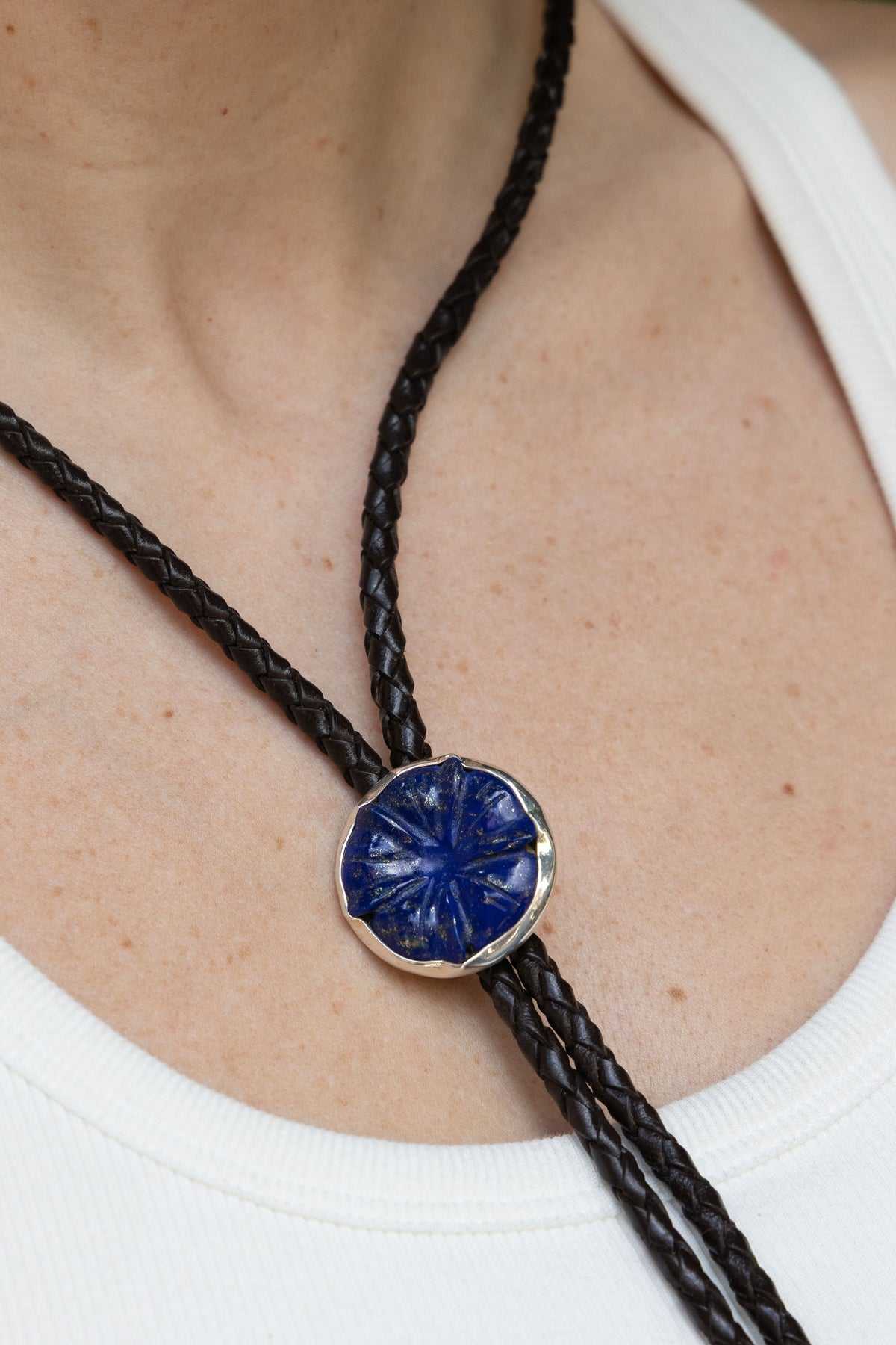 Lapis Flower Bolo Tie in sterling silver with braided leather cord, on model — handmade in Taxco, Mexico