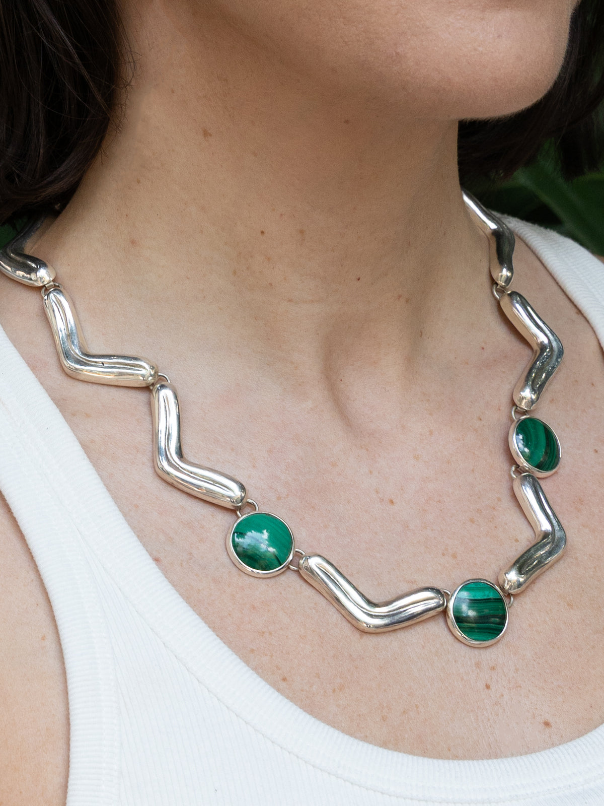 Lengua Trio Necklace in sterling silver with malachite, worn on the model — handmade in Taxco, Mexico #Gemstone Type_Malachite