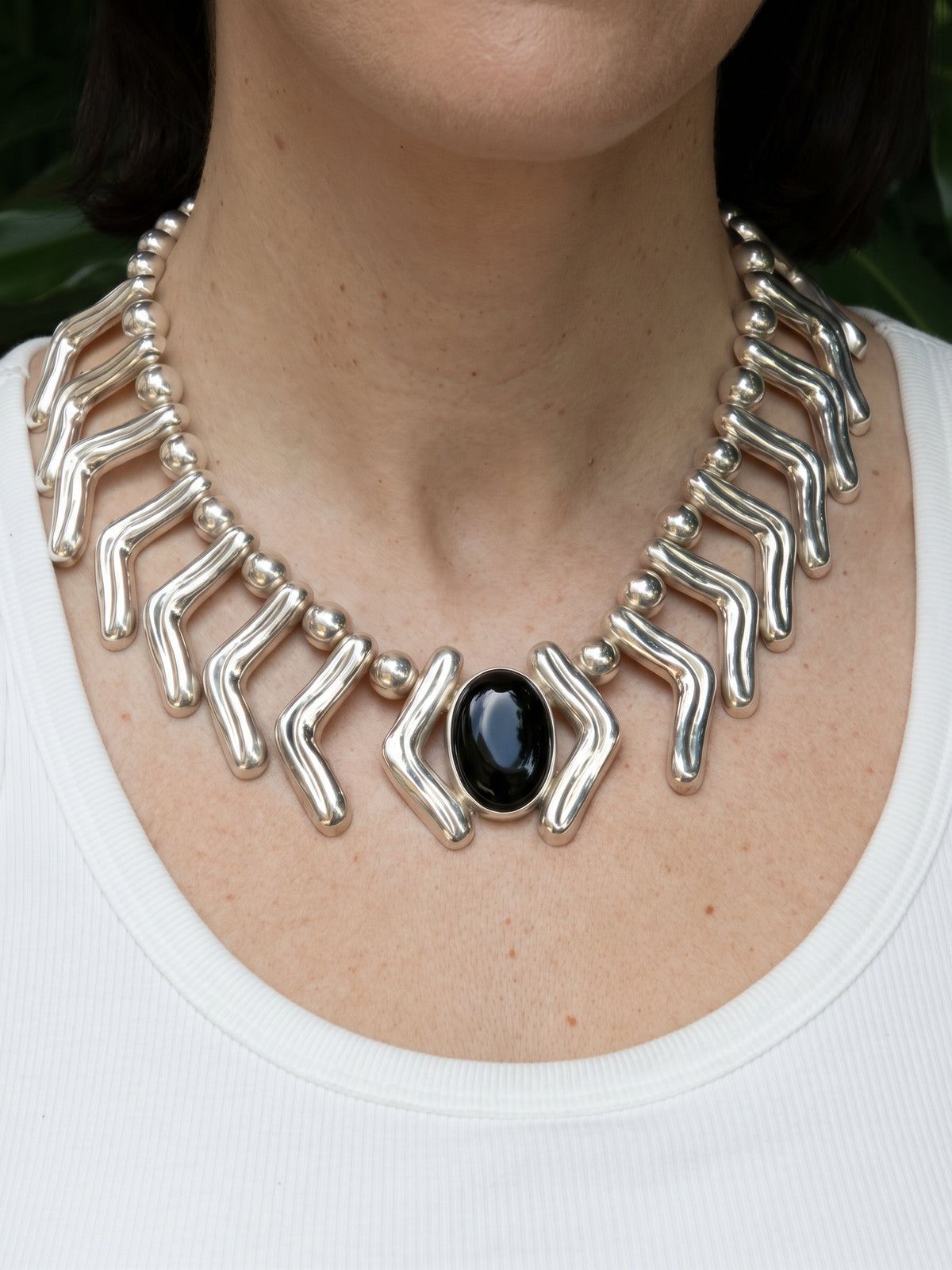 Lilly Necklace in sterling silver with black onyx, worn on the model — handmade in Taxco, Mexico #Gemstone Type_Onyx