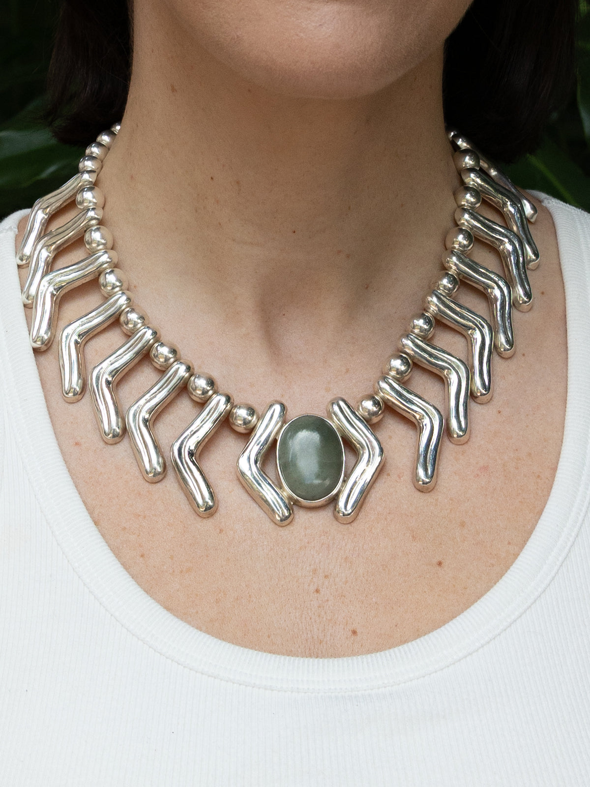 Lilly Necklace in sterling silver with jade, worn on the model — handmade in Taxco, Mexico #Gemstone Type_Jade