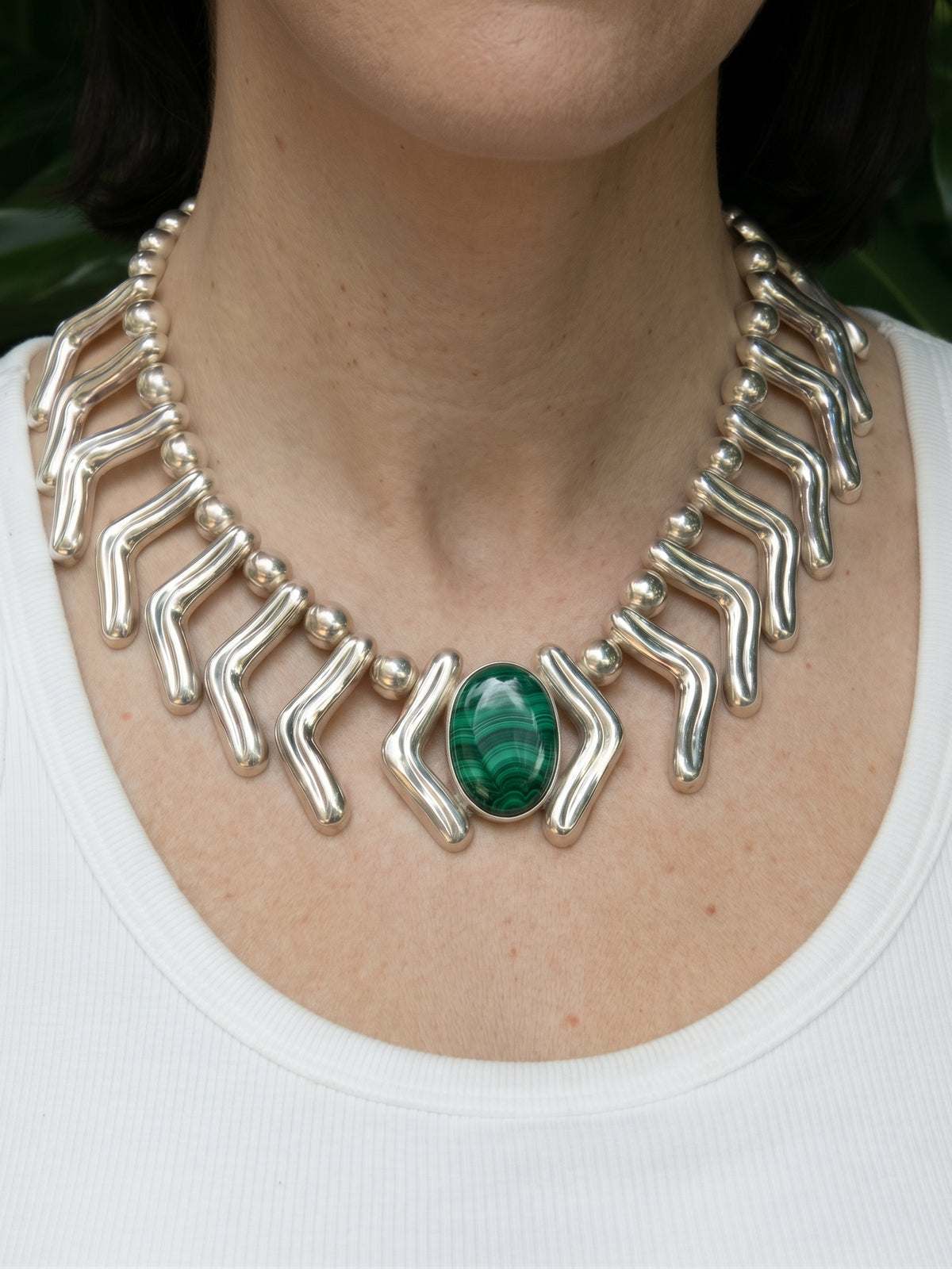 Lilly Necklace in sterling silver with malachite, worn on the model — handmade in Taxco, Mexico #Gemstone Type_Malachite