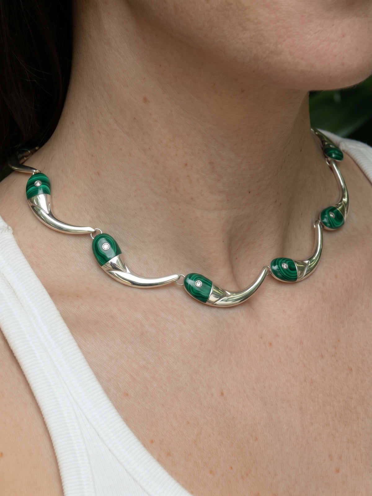 Pez Necklace in sterling silver with malachite, worn on the model — handmade in Taxco, Mexico #Gemstone Type_Malachite
