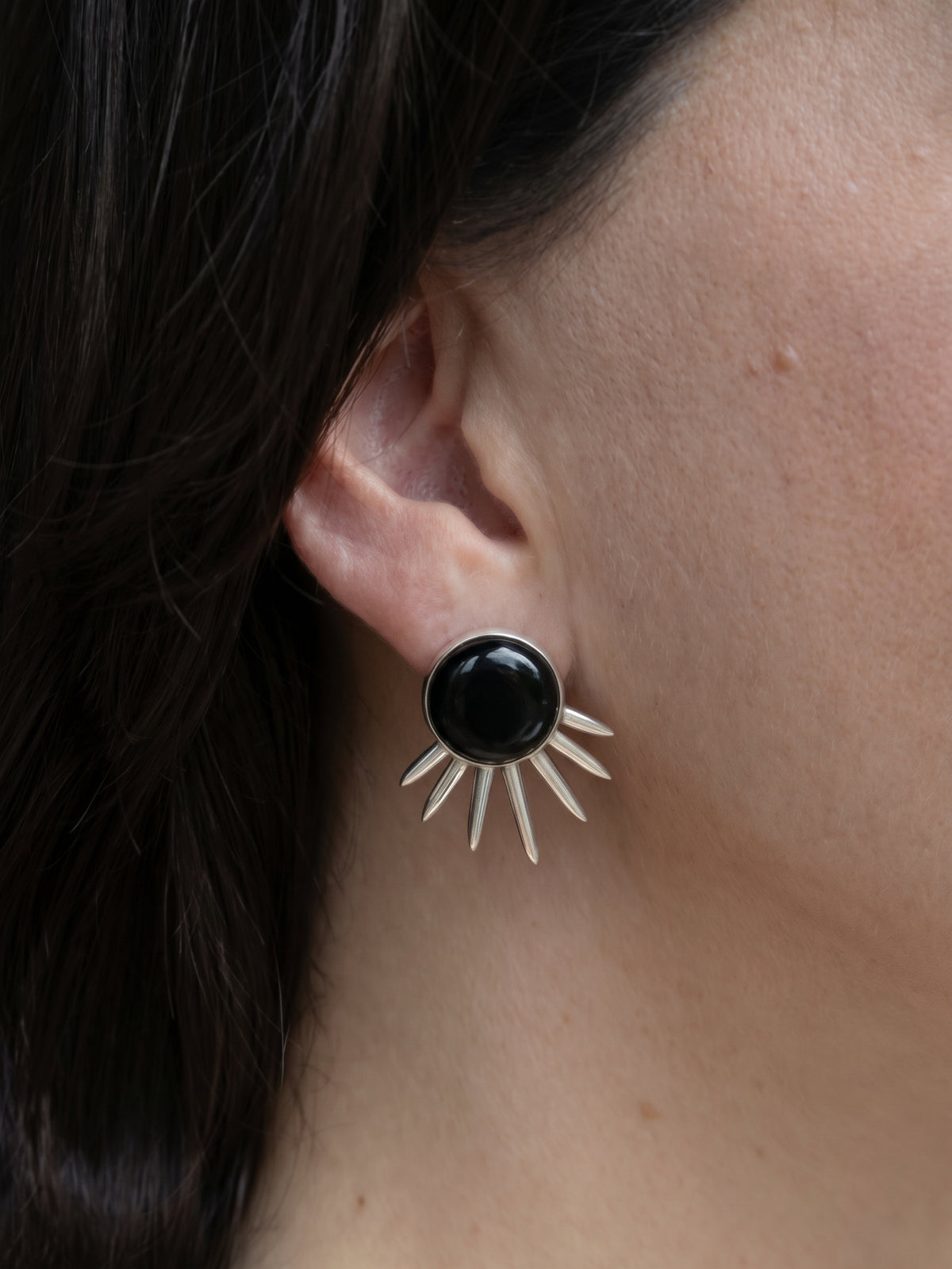 Sol Earrings in sterling silver with black onyx, worn on the ear — handmade in Taxco, Mexico #Gemstone Type_Onyx