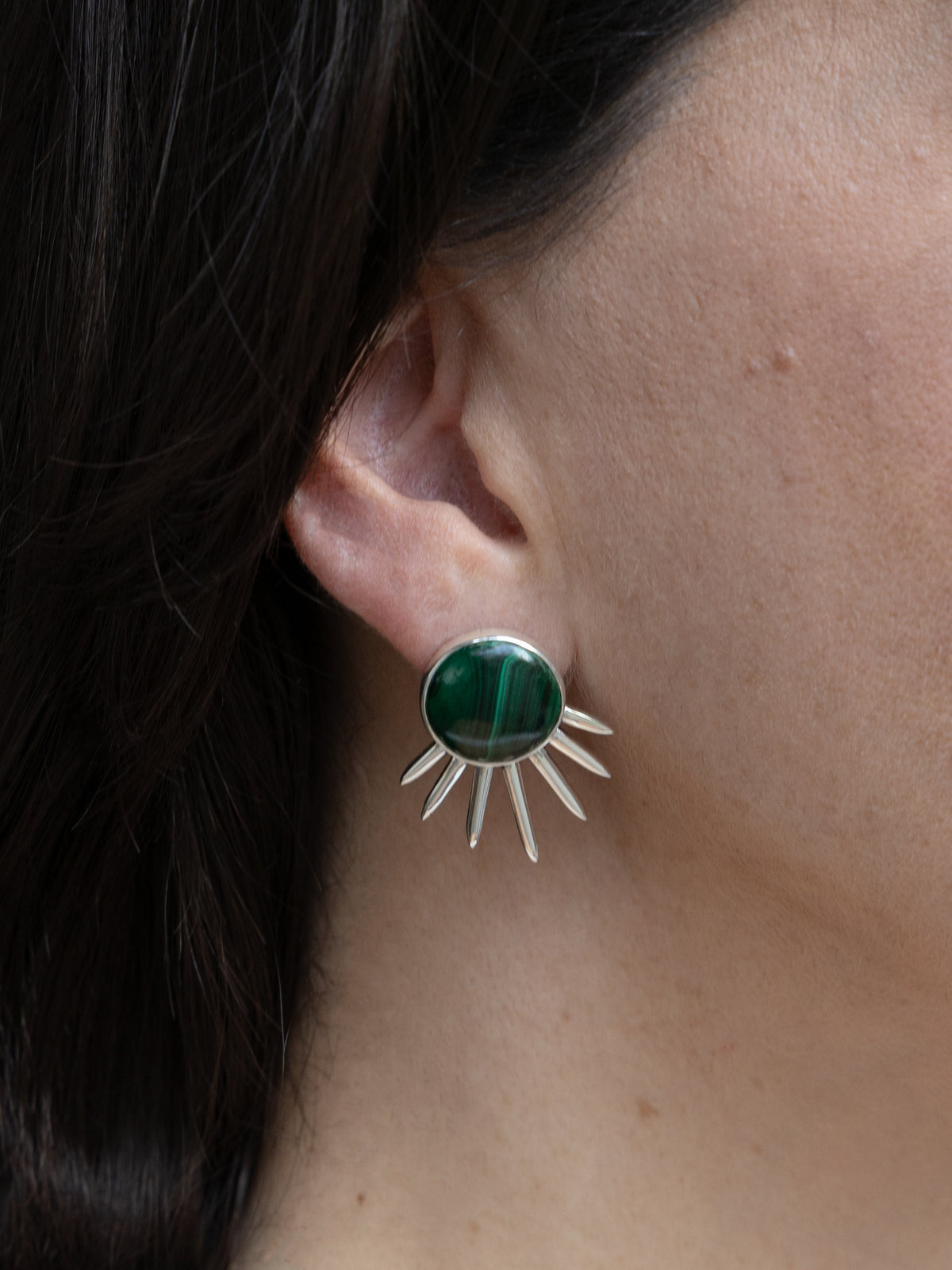 Sol Earrings in sterling silver with malachite, worn on the ear — handmade in Taxco, Mexico #Gemstone Type_Malachite