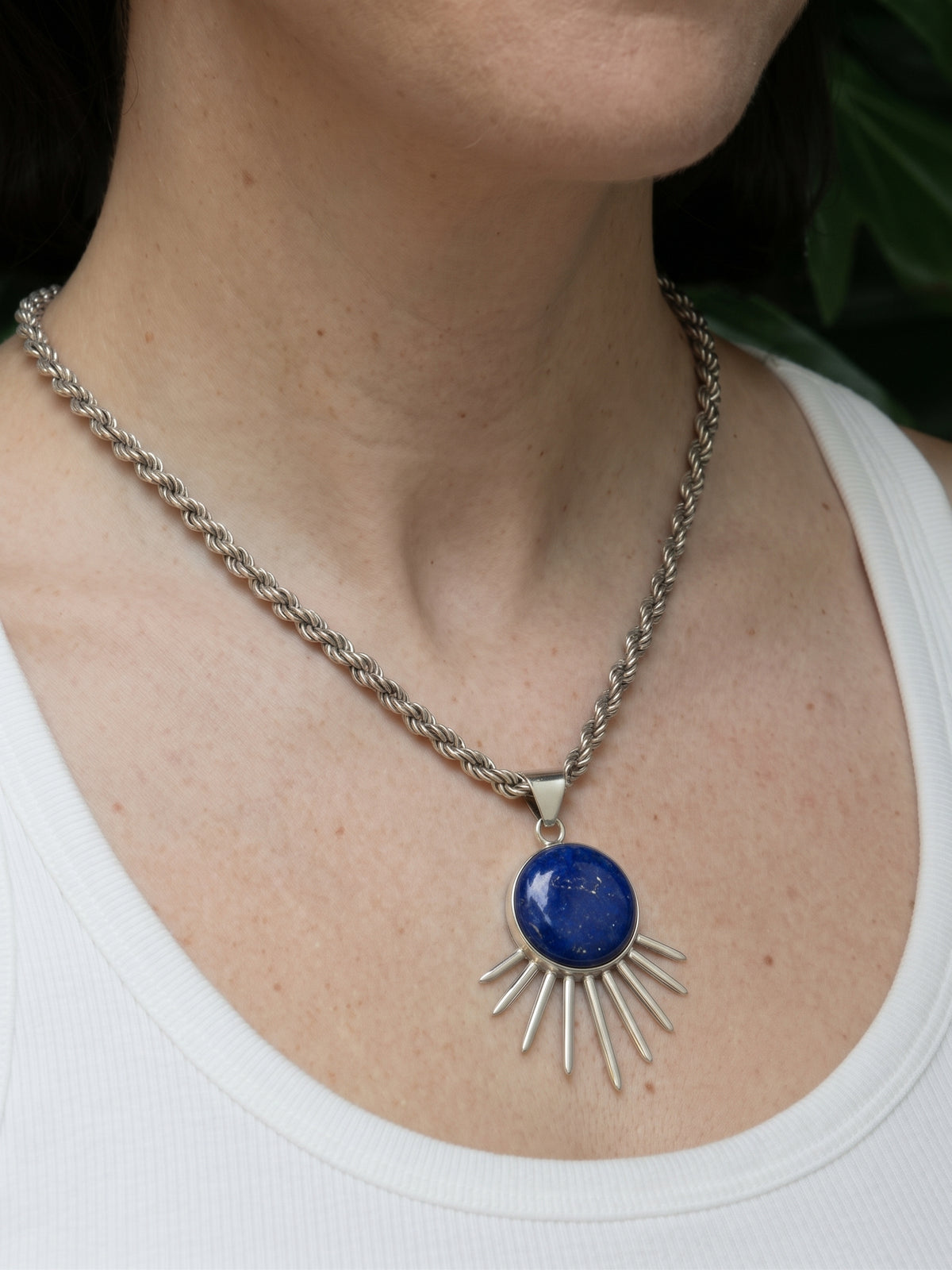 Sol Pendant in sterling silver with lapis lazuli, worn on the model — handmade in Taxco, Mexico #Gemstone Type_Lapis lazuli