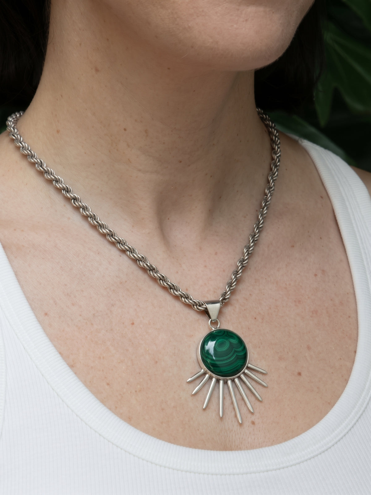 Sol Pendant in sterling silver with malachite, worn on the model — handmade in Taxco, Mexico #Gemstone Type_Malachite