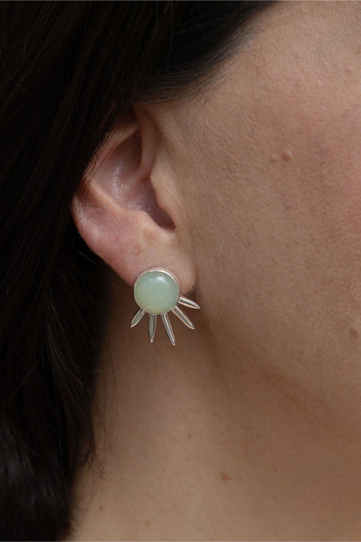 Sol Pequeño Earrings in sterling silver with jade, worn on the ear — handmade in Taxco, Mexico #Gemstone Type_Jade