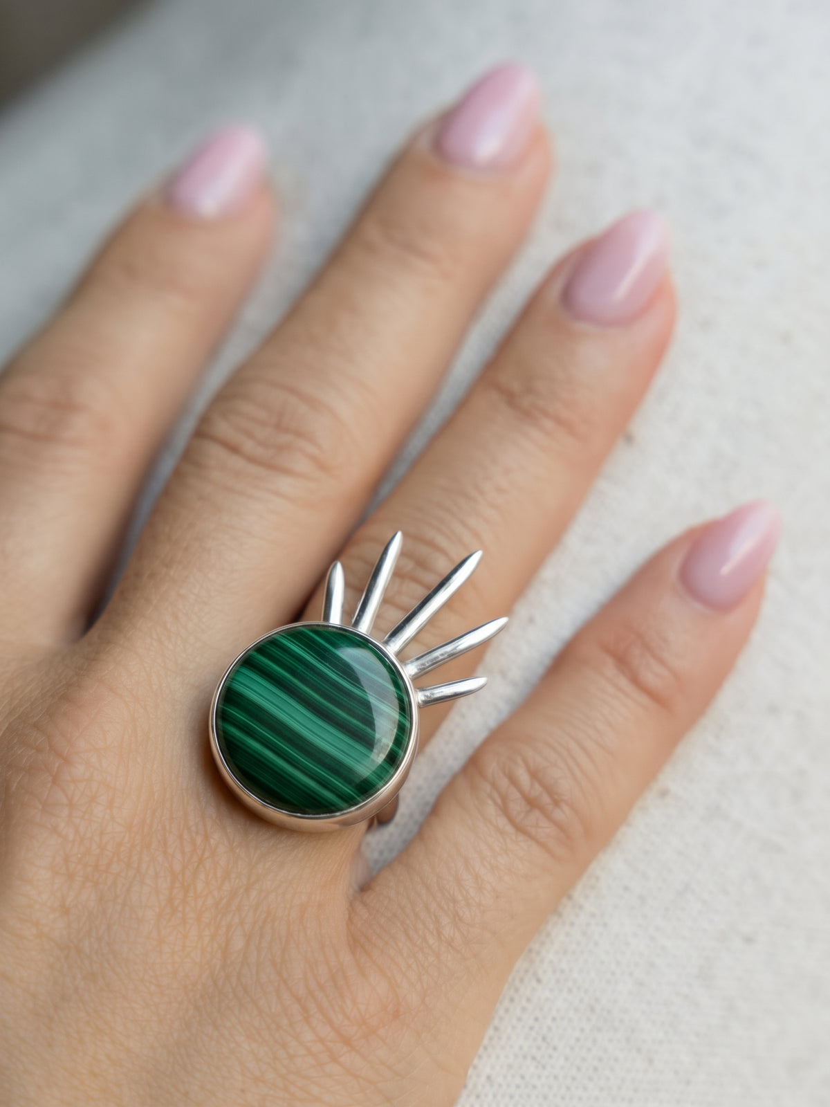 Sol Ring in sterling silver with malachite, worn on the hand — handmade in Taxco, Mexico #Gemstone Type_Malachite